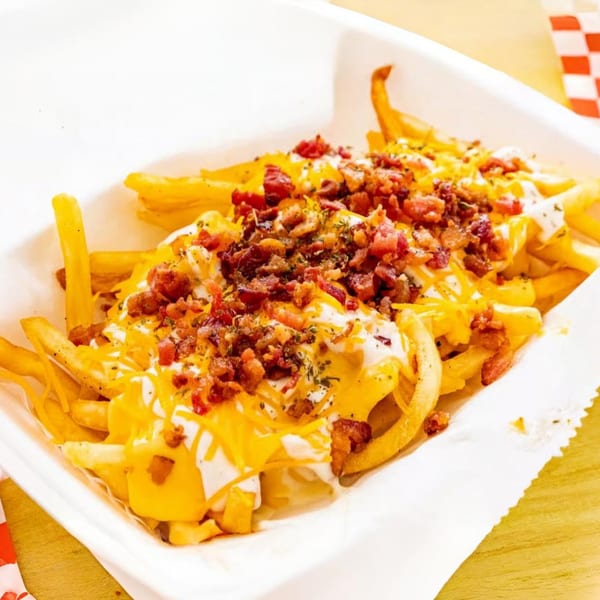 Le Roux's Chicken Shack loaded fries with melted cheese, bacon bits, and ranch dressing.